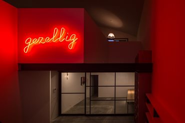 Gezellig Neon light signage, internal void space. Photography by Trevor Mein
