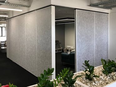 The brief was to create a user-friendly operable wall with a DDA-compliant panel-hung pass door