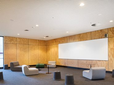 The solution needed to balance superior acoustics seamlessly with the school’s sophisticated design aesthetic 