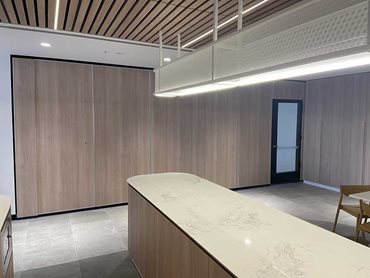 The operable wall was designed to make the entire reception area space adaptable and functional