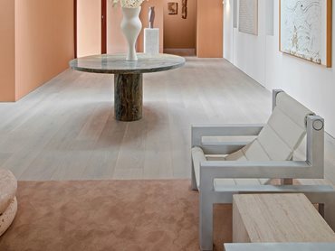 The wide plank flooring in the beautiful platinum tones of Blanco added width and dimension to the space 