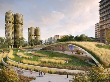 An elevated landscape bridge connects the parklands