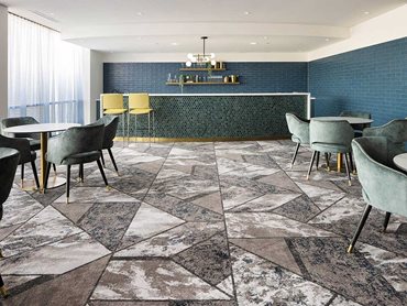 Irregular geometric shapes, interspersed with bold borders, delivered both energy and timeless style in the Function Room and Bar