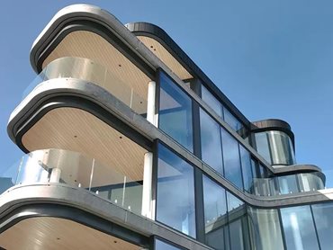 Structural laminated 13.5mm Sentryglas was used to fabricate the curved railings