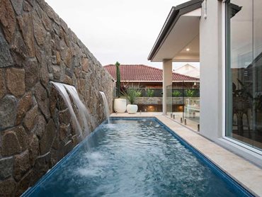 Low clay content travertine, dense hard sandblasted marbles, dense/ dolomitic limestones and basalts are the go-to for pool surrounds