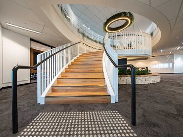 The ‘linking hands’ staircase is the centrepiece of the workspace at Deloitte’s Parramatta office