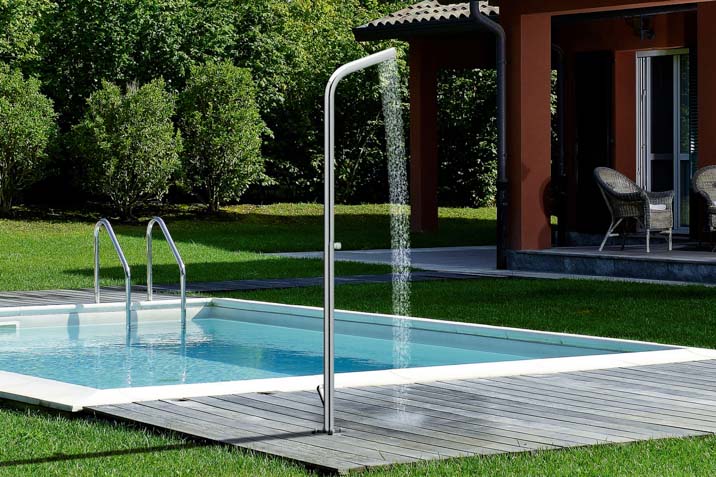 freestanding outdoor shower beside pool for rinse