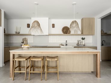 The stunning kitchen design has a beautiful island bench as the centrepiece