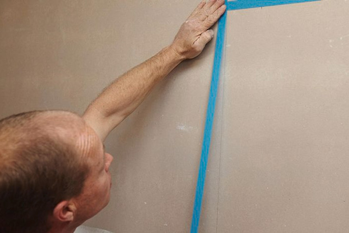 masking tape marking shower waterproofing bathroom renovation DIY