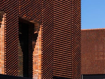 The brick’s earthy richness connects the station to place, while its pale colour beautifully takes on the shadows when the light hits it