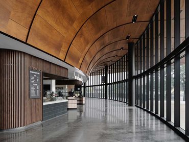 The soffit design stretches into the interior, extending the warmth of the natural wood 