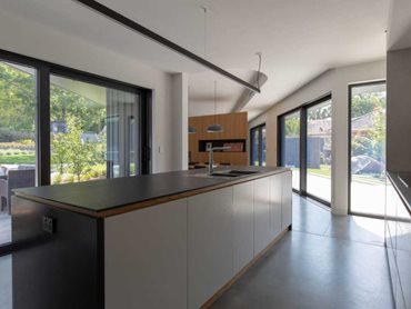 Schüco sliding doors open the interior, providing abundant natural light