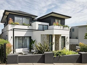 A simple monotone palette of stone, timber and Petersen D91 bricks creates a sense of timelessness on the external facade