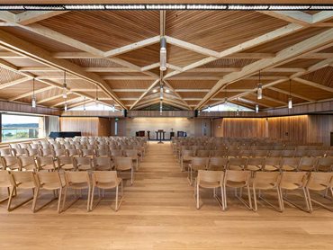 Chapel: SUPACOUSTIC V-slotted panels in Blackbutt natural timber veneer, create a stunning feature across a raked ceiling 
