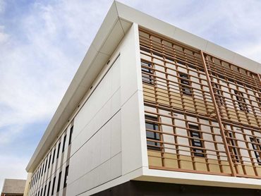 Mitsubishi ALPOLIC NC/A1 panels in Milk White easily matched the building’s aesthetic