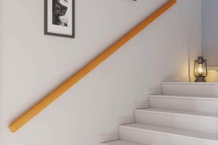 wooden stairs with wall mounted railing