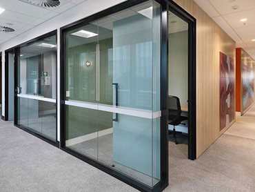 Black AS104 partitioning was paired with black Himmel flat bar aluminium skirting to segment and frame the meeting rooms 