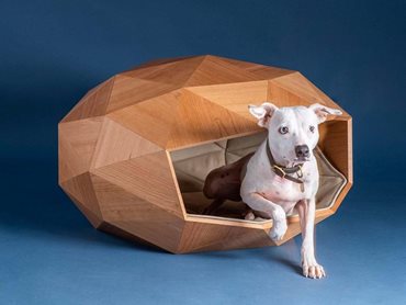 Made from engineered cherry wood, the kennel reimagines canine luxury