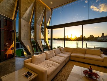 The faceted glazing elements extend the riverfront view 