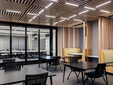 The perforated panels were selected for the lobby areas, passageways, and meeting rooms 