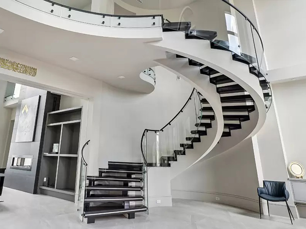 Both staircases feature Glasshape’s signature TemperShield clear, bent and toughened glass