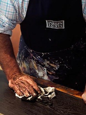 The floor boards are hand-scraped and rubbed to develop an aged, worn-in look
