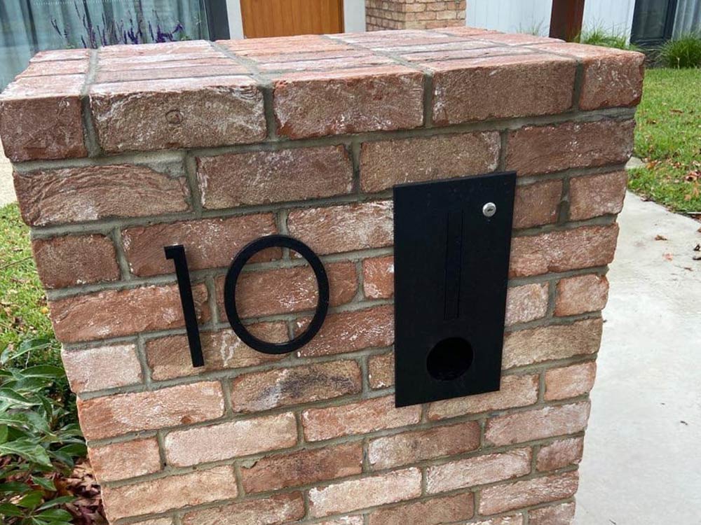 Installing house numbers in brick