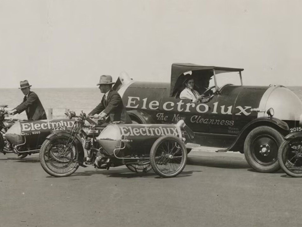 Electrolux motorcycles and cars lined up on the waterfront in Melbourne